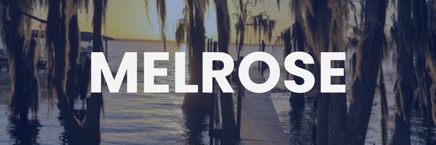 Golden sunrise over Santa Fe Lake and the creative heart of Melrose, Florida